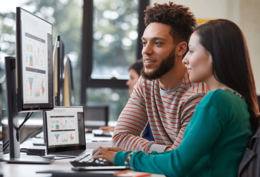 project-two-people-seated-at-a-workstation-looking-at-a-monitor-interstellar-business-solutions-limited-ibsl