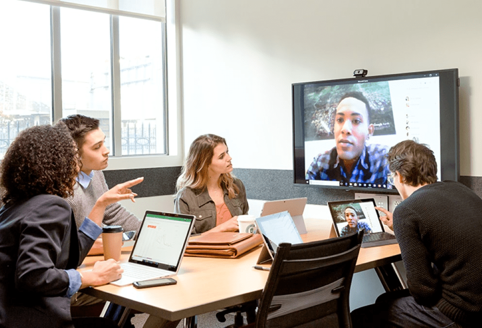 photograph-of-a-group-in-a-conference-room-interacting-with-someone-in-another-location-via-web-conferencing-interstellar-business-solutions-limited-ibsl